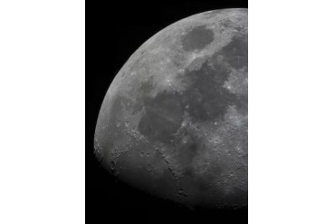 The limb and terminator of the waxing gibbous moon.